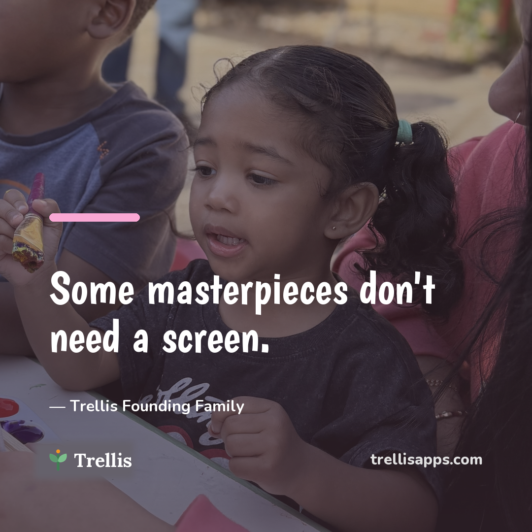 Kids making art at an outdoor table — some masterpieces don't need a screen